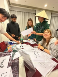 Students were experiencing the Arabic Calligraphy with the guidance of Usman (Computer Science/Year 2), the Pakistani student host. 